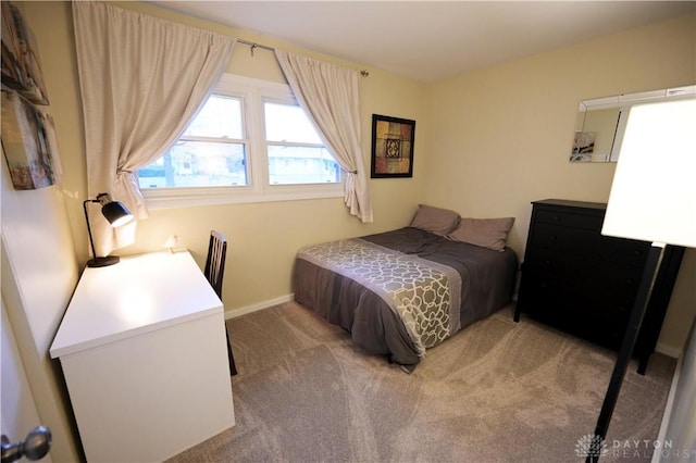 1265 Jeanette Dr, Dayton, OH 45432 - bedroom featuring light carpet and baseboards