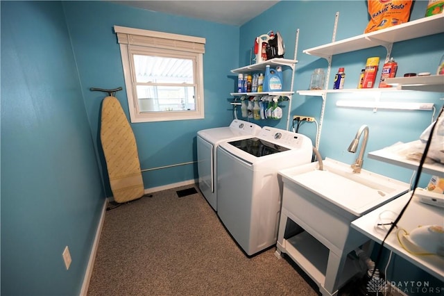 1265 Jeanette Dr, Dayton, OH 45432 - washroom featuring washing machine and clothes dryer, carpet, and baseboards