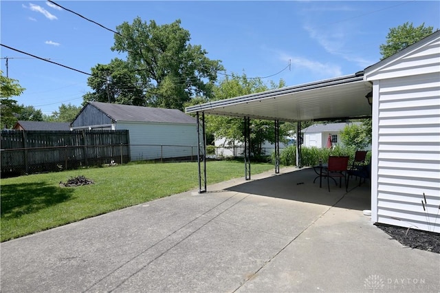 1265 Jeanette Dr, Dayton, OH 45432 - view of vehicle parking featuring driveway and an attached carport