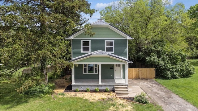 50 Winnet Dr, Dayton, OH 45415 - traditional style home featuring covered porch, concrete driveway, and a gate