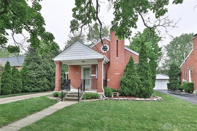 407 Claranna Ave, Oakwood, OH 45419 - bungalow with brick siding, a front yard, an outdoor structure, and a chimney
