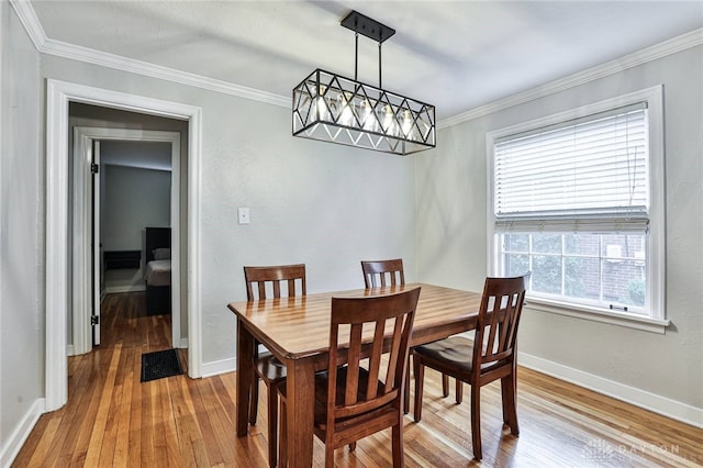 407 Claranna Ave, Oakwood, OH 45419 - dining room with light wood-style floors and crown molding