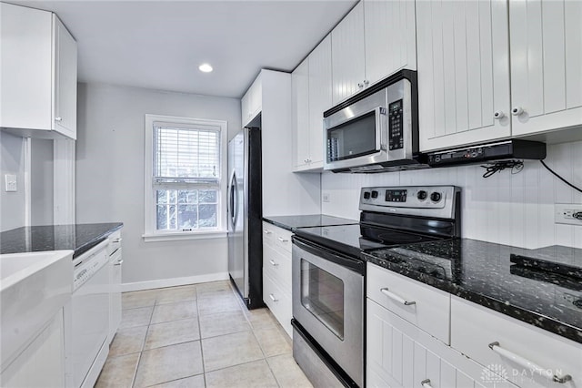 407 Claranna Ave, Oakwood, OH 45419 - kitchen featuring stainless steel appliances, white cabinets, light tile patterned flooring, dark stone countertops, and recessed lighting