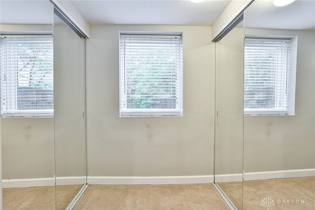 407 Claranna Ave, Oakwood, OH 45419 - unfurnished bedroom featuring carpet and multiple windows