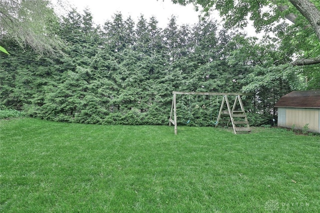 407 Claranna Ave, Oakwood, OH 45419 - view of green lawn with a playground and a storage shed