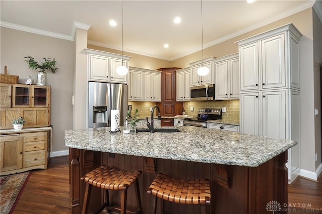 7516 Blue Fox Run, West Chester, OH 45069 - kitchen featuring stainless steel appliances, dark wood-style flooring, light stone counters, tasteful backsplash, and ornamental molding