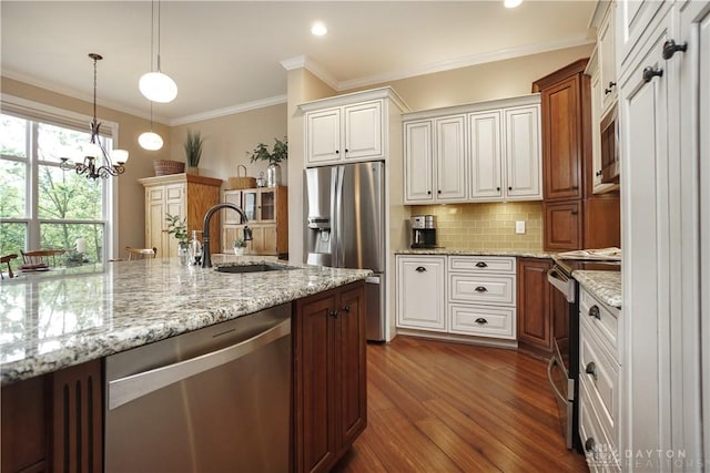 7516 Blue Fox Run, West Chester, OH 45069 - kitchen featuring stainless steel appliances, dark wood-style floors, backsplash, a chandelier, and pendant lighting