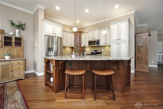 7516 Blue Fox Run, West Chester, OH 45069 - kitchen featuring stainless steel appliances, dark wood-style flooring, tasteful backsplash, light stone counters, and a kitchen bar