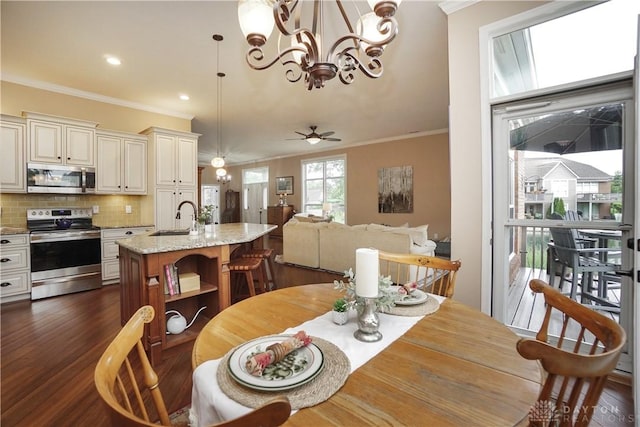 7516 Blue Fox Run, West Chester, OH 45069 - dining room featuring crown molding, a chandelier, dark wood finished floors, recessed lighting, and a ceiling fan