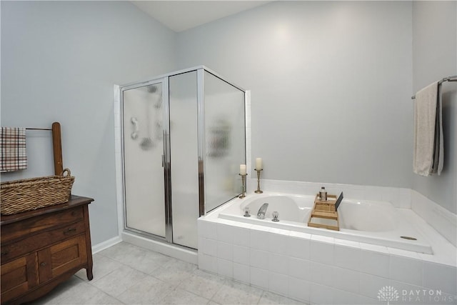 7516 Blue Fox Run, West Chester, OH 45069 - full bathroom featuring a garden tub, a stall shower, and tile patterned floors