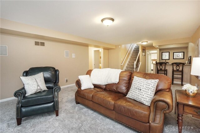 7516 Blue Fox Run, West Chester, OH 45069 - living room with stairs and carpet floors