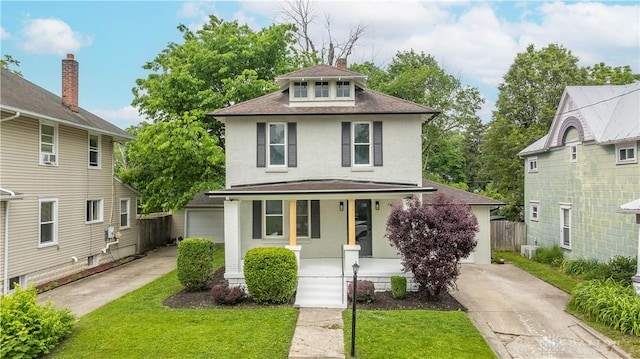 522 Pennsylvania Ave, Troy, OH 45373 - american foursquare style home with a porch, stucco siding, roof with shingles, a chimney, and concrete driveway