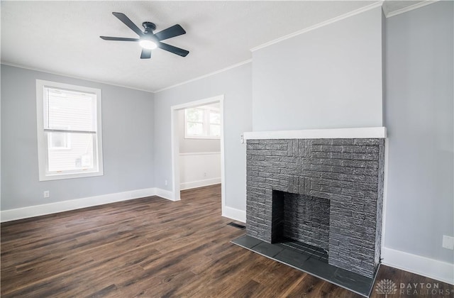 522 Pennsylvania Ave, Troy, OH 45373 - unfurnished living room featuring ornamental molding, a fireplace, baseboards, ceiling fan, and dark wood-type flooring