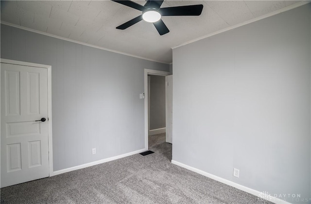 522 Pennsylvania Ave, Troy, OH 45373 - carpeted spare room with a ceiling fan, crown molding, and baseboards