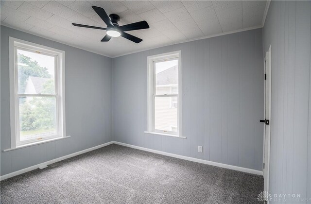 522 Pennsylvania Ave, Troy, OH 45373 - empty room featuring plenty of natural light, carpet flooring, ceiling fan, and baseboards