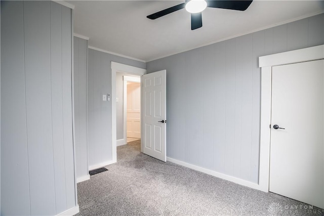 522 Pennsylvania Ave, Troy, OH 45373 - unfurnished bedroom featuring carpet floors, ornamental molding, baseboards, and a ceiling fan
