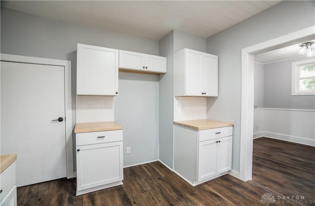 522 Pennsylvania Ave, Troy, OH 45373 - kitchen with white cabinetry, decorative backsplash, and dark wood-type flooring
