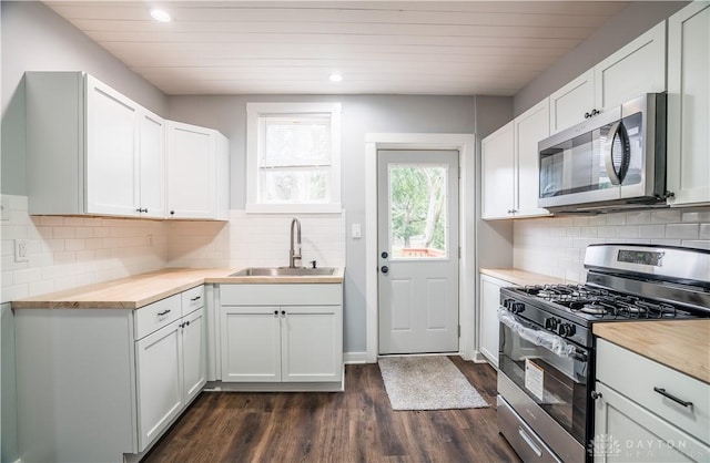 522 Pennsylvania Ave, Troy, OH 45373 - kitchen featuring appliances with stainless steel finishes, a sink, dark wood-style flooring, recessed lighting, and decorative backsplash