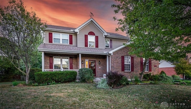 20 Pembrook Ct, Springboro, OH 45066 - traditional-style home featuring brick siding, a front lawn, and a porch