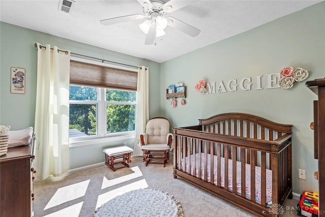 20 Pembrook Ct, Springboro, OH 45066 - carpeted bedroom featuring a crib, a ceiling fan, and baseboards