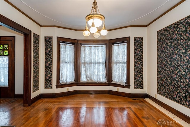 1628 E 5th St, Dayton, OH 45403 - empty room featuring hardwood / wood-style flooring, a chandelier, ornamental molding, and baseboards