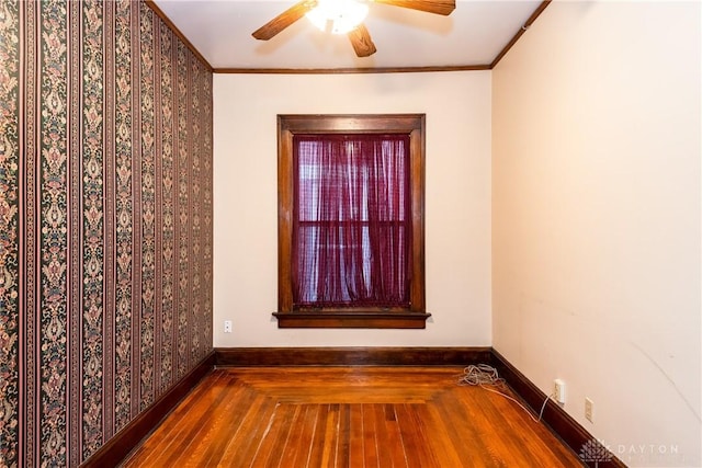 1628 E 5th St, Dayton, OH 45403 - unfurnished room featuring baseboards, ceiling fan, wood finished floors, and ornamental molding