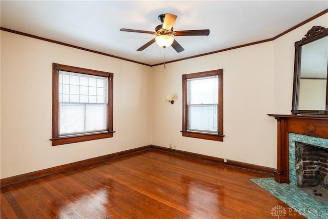 1628 E 5th St, Dayton, OH 45403 - unfurnished living room featuring wood finished floors, baseboards, a ceiling fan, a high end fireplace, and ornamental molding