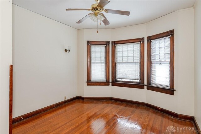 1628 E 5th St, Dayton, OH 45403 - empty room with wood-type flooring, baseboards, and ceiling fan