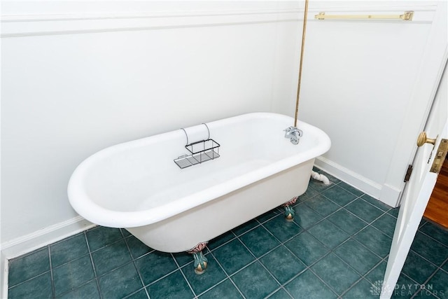 1628 E 5th St, Dayton, OH 45403 - bathroom view of a freestanding tub and baseboards
