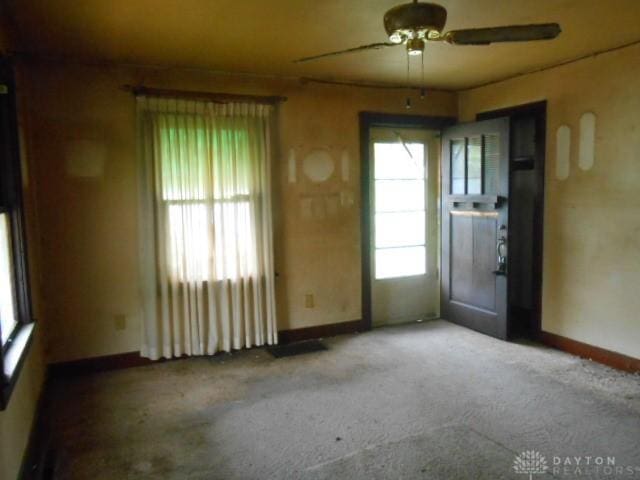 1202 Burt St, Springfield, OH 45505 - carpeted spare room with baseboards and a ceiling fan