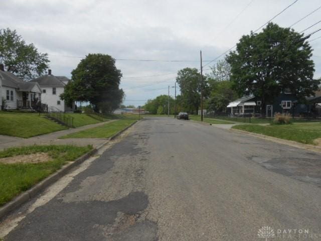 1202 Burt St, Springfield, OH 45505 - view of asphalt road featuring curbs and sidewalks