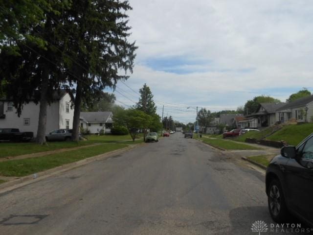 1202 Burt St, Springfield, OH 45505 - view of asphalt road featuring sidewalks, a residential view, and curbs