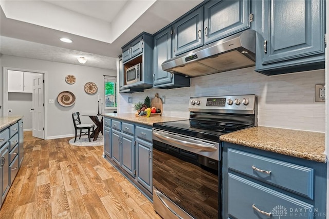 286 Honey Jane Dr, Beavercreek, OH 45434 - kitchen with stainless steel appliances, under cabinet range hood, blue cabinets, recessed lighting, and tasteful backsplash