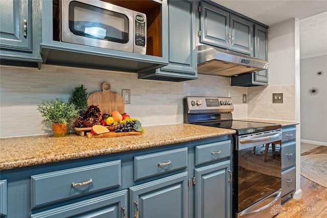 286 Honey Jane Dr, Beavercreek, OH 45434 - kitchen with appliances with stainless steel finishes, under cabinet range hood, light wood-style flooring, and blue cabinetry