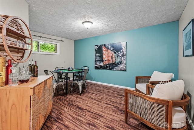286 Honey Jane Dr, Beavercreek, OH 45434 - dining space featuring wood finished floors, a textured ceiling, and baseboards