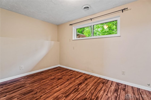 286 Honey Jane Dr, Beavercreek, OH 45434 - empty room featuring wood finished floors, baseboards, and a textured ceiling