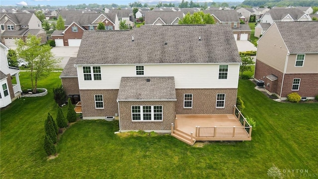 9752 Crooked Creek Dr, Centerville, OH 45458 - rear view of house featuring brick siding, a residential view, and a lawn