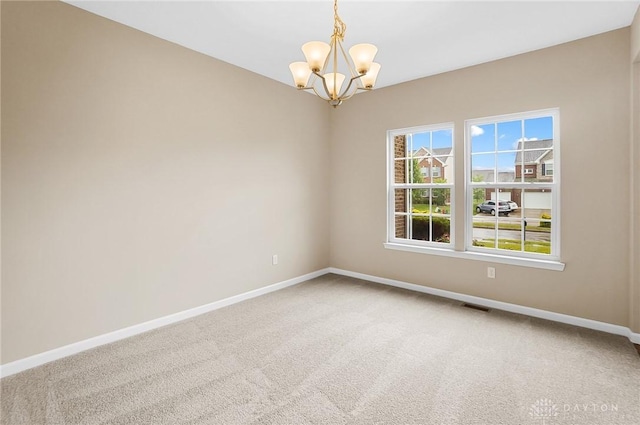 9752 Crooked Creek Dr, Centerville, OH 45458 - spare room with baseboards, carpet, and a chandelier