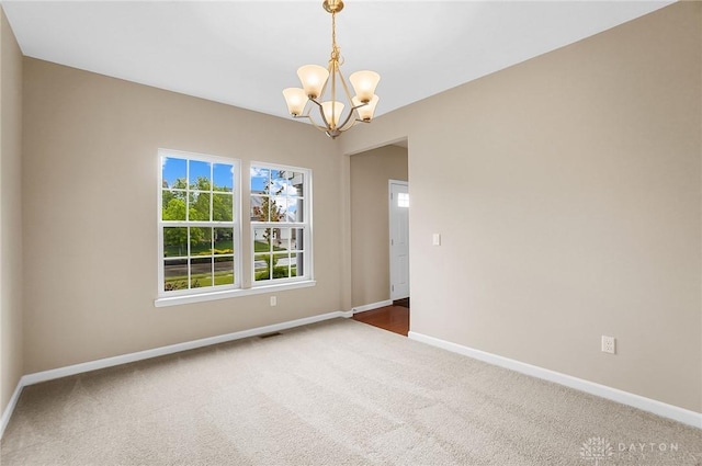 9752 Crooked Creek Dr, Centerville, OH 45458 - unfurnished room featuring carpet, a chandelier, and baseboards