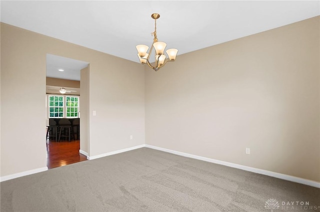 9752 Crooked Creek Dr, Centerville, OH 45458 - carpeted empty room featuring a chandelier, baseboards, and ceiling fan