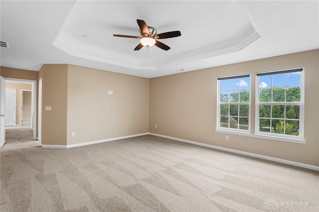 9752 Crooked Creek Dr, Centerville, OH 45458 - spare room with a tray ceiling, light colored carpet, a ceiling fan, and baseboards