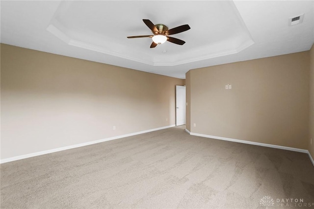 9752 Crooked Creek Dr, Centerville, OH 45458 - carpeted spare room featuring a raised ceiling, a ceiling fan, and baseboards