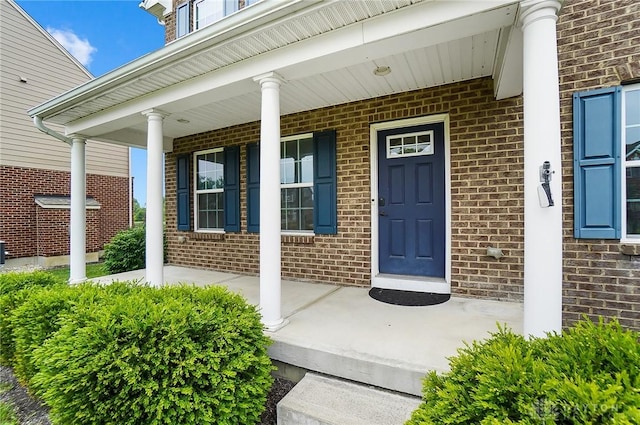 9752 Crooked Creek Dr, Centerville, OH 45458 - doorway to property with a porch and brick siding
