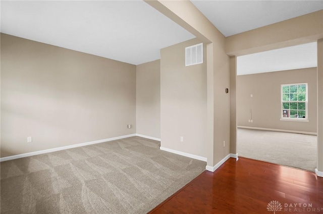 9752 Crooked Creek Dr, Centerville, OH 45458 - carpeted spare room featuring baseboards and wood finished floors