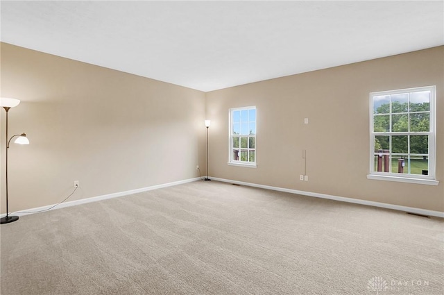 9752 Crooked Creek Dr, Centerville, OH 45458 - spare room with baseboards and light carpet