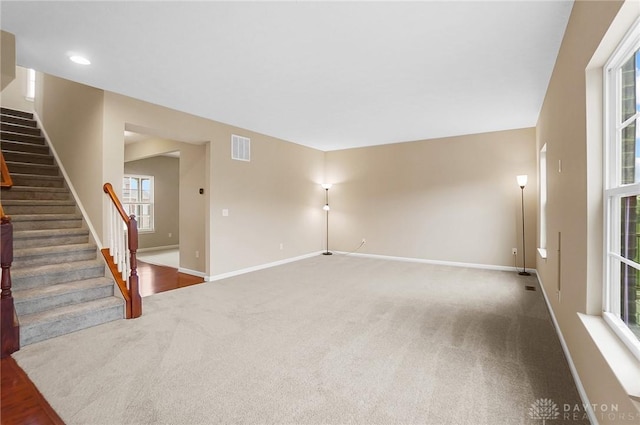 9752 Crooked Creek Dr, Centerville, OH 45458 - unfurnished living room with carpet floors, stairs, baseboards, and recessed lighting