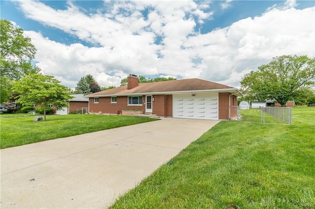 692 Sueden Dr, Beavercreek, OH 45430 - ranch-style home featuring an attached garage, brick siding, a chimney, and concrete driveway