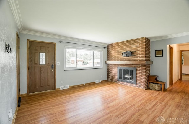 692 Sueden Dr, Beavercreek, OH 45430 - unfurnished living room with a fireplace, crown molding, wood finished floors, and baseboards