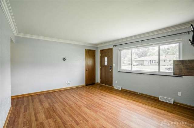 692 Sueden Dr, Beavercreek, OH 45430 - unfurnished room with crown molding, wood finished floors, and baseboards