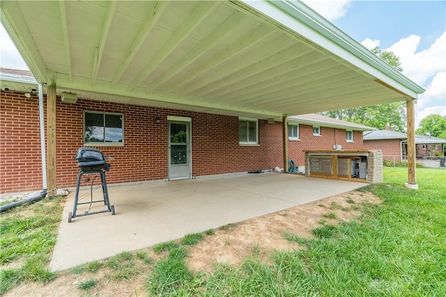 692 Sueden Dr, Beavercreek, OH 45430 - view of patio / terrace featuring an attached carport and area for grilling